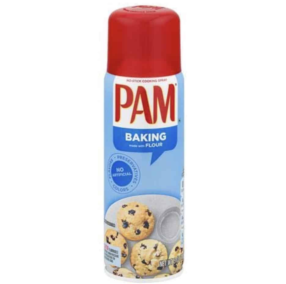 A can of PAM Baking non-stick cooking spray with a red cap, featuring an image of chocolate chip cookies—perfect for your next flower cookies recipe—and a baking pan on the blue and white label.